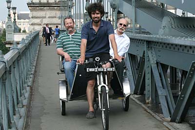 Andy and Ted return to the hotel in a rickshaw